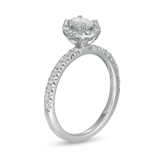 Previously Owned - 1 CT. T.w. Oval Diamond Frame Engagement Ring in 14K White Gold (I/I2)