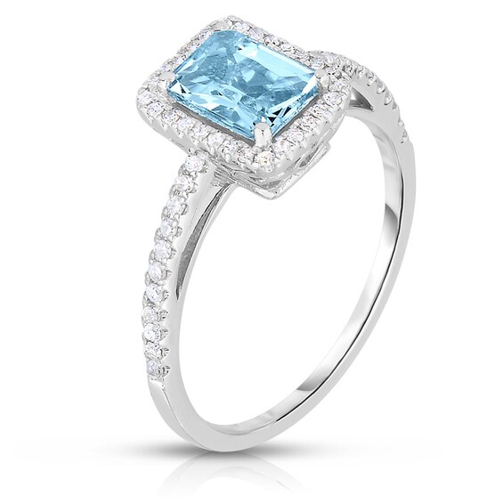 Previously Owned - Emerald-Cut Aquamarine and 1/5 CT. T.w. Diamond Frame Ring in 14K White Gold
