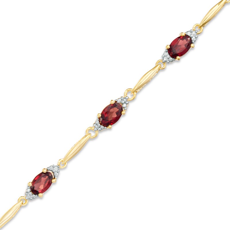Main Image 1 of Previously Owned - Oval Garnet and Diamond Accent Bracelet in Sterling Silver and 10K Gold Plate - 7.25"