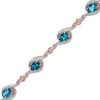 Thumbnail Image 1 of Previously Owned - London Blue Topaz and White Lab-Created Sapphire Bracelet in Sterling Silver with 14K Rose Gold Plate