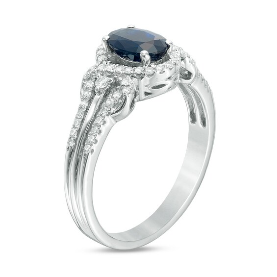 Previously Owned - Oval Blue Sapphire and 1/4 CT. T.w. Diamond Frame Ring in 10K White Gold