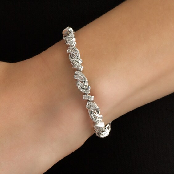 Previously Owned - 2 CT. T.w. Baguette and Round Diamond Bypass Bracelet in Sterling Silver