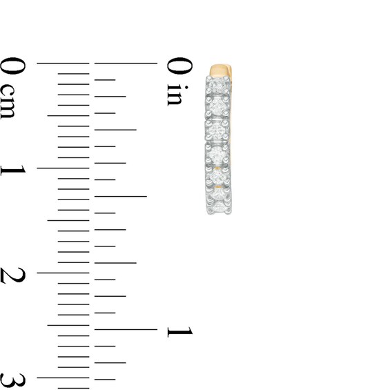 Previously Owned - 1/4 CT. T.w. Diamond Huggie Hoop Earrings in 14K Gold