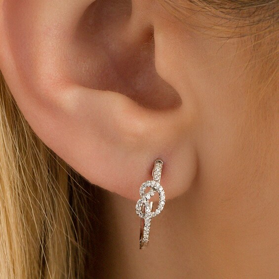 Previously Owned - 1/6 CT. T.w. Diamond Knot Hoop Earrings in Sterling Silver