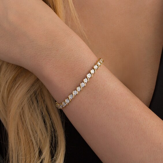 Previously Owned - 1/10 CT. T.w. Diamond "S" Tennis Bracelet in Sterling Silver with 14K Gold Plate - 7.25"