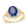 Thumbnail Image 1 of Previously Owned - Oval Lab-Created Blue Sapphire and 1/20 CT. T.W. Diamond Frame Buckle Ring in 10K Gold