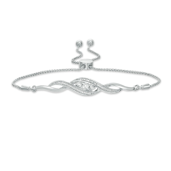 Previously Owned - 1/15 CT. T.w. Diamond Three Stone Twist Bolo Bracelet in Sterling Silver - 9.5"