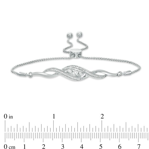 Previously Owned - 1/15 CT. T.w. Diamond Three Stone Twist Bolo Bracelet in Sterling Silver - 9.5"