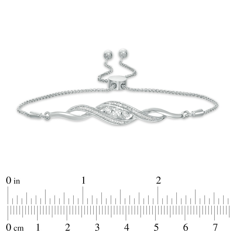 Main Image 2 of Previously Owned - 1/15 CT. T.W. Diamond Three Stone Twist Bolo Bracelet in Sterling Silver - 9.5"