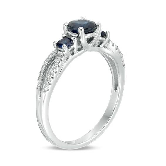 Previously Owned - Blue Sapphire and 1/8 CT. T.w. Diamond Three Stone Split Shank Ring in 10K White Gold