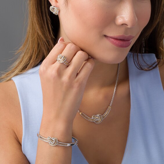 Previously Owned - 1/5 CT. T.w. Diamond Love Knot Four Piece Set in Sterling Silver with 10K Gold Plate
