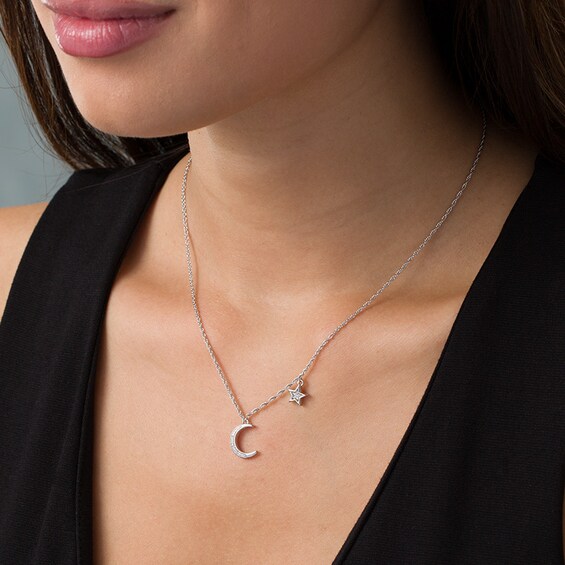 Previously Owned - 1/15 CT. T.w. Diamond Crescent Moon and Star Necklace in Sterling Silver