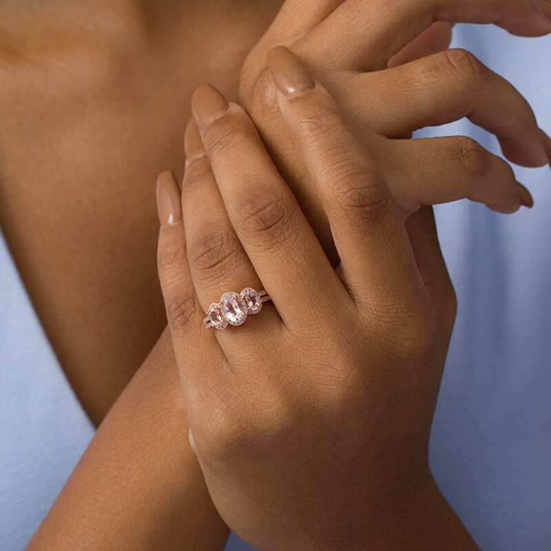 Main Image 2 of Previously Owned - Oval Morganite and 1/4 CT. T.W. Diamond Three Stone Frame Ring in 10K Rose Gold