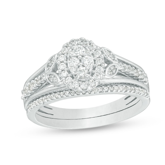 Previously Owned - 1/2 CT. T.w. Oval Composite Diamond Leaf-Sides Bridal Set in Sterling Silver