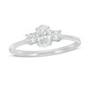 Thumbnail Image 1 of Previously Owned - 5/8 CT. T.W. Oval and Round Diamond Three Stone Engagement Ring in 14K White Gold