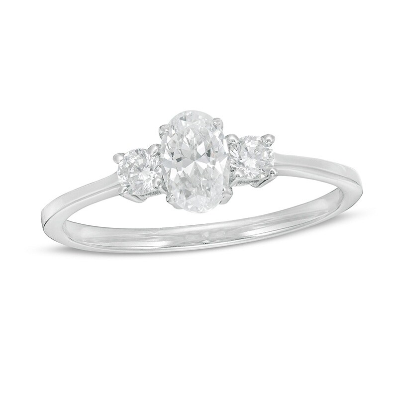 Main Image 1 of Previously Owned - 5/8 CT. T.W. Oval and Round Diamond Three Stone Engagement Ring in 14K White Gold