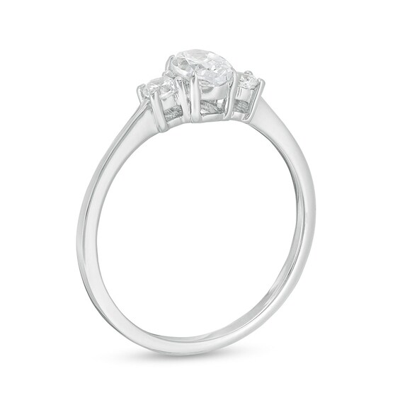 Previously Owned - 5/8 CT. T.w. Oval and Round Diamond Three Stone Engagement Ring in 14K White Gold