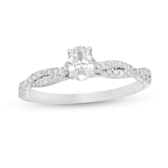 Previously Owned - 1/2 CT. T.w. Oval Diamond Twist Engagement Ring in 14K White Gold