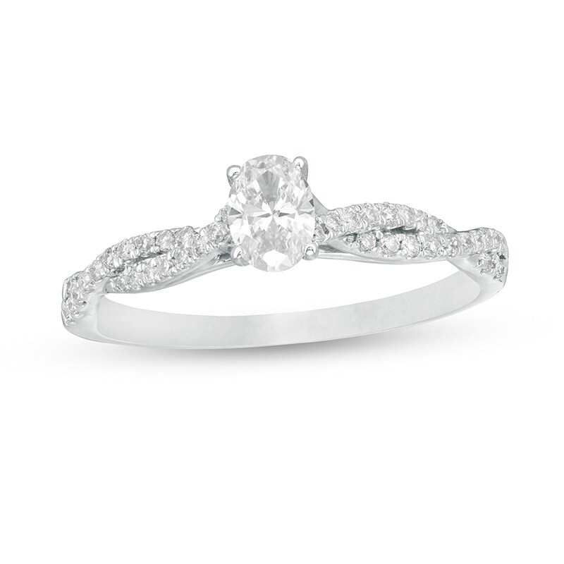 Main Image 1 of Previously Owned - 1/2 CT. T.W. Oval Diamond Twist Engagement Ring in 14K White Gold