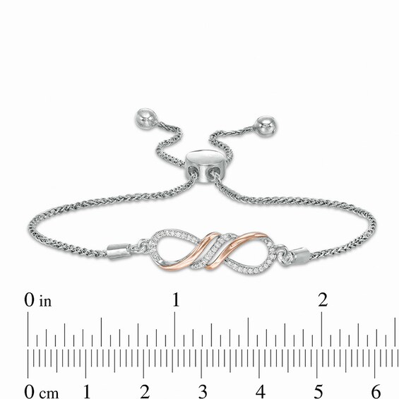 Previously Owned - 1/15 CT. T.w. Diamond Sideways Infinity Bolo Bracelet in Sterling Silver and 10K Rose Gold - 9.5"