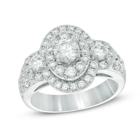 Previously Owned - Celebration Ideal 2 CT. T.w. Diamond Layered Oval Frame Three Stone Ring in 14K White Gold (I/I1)