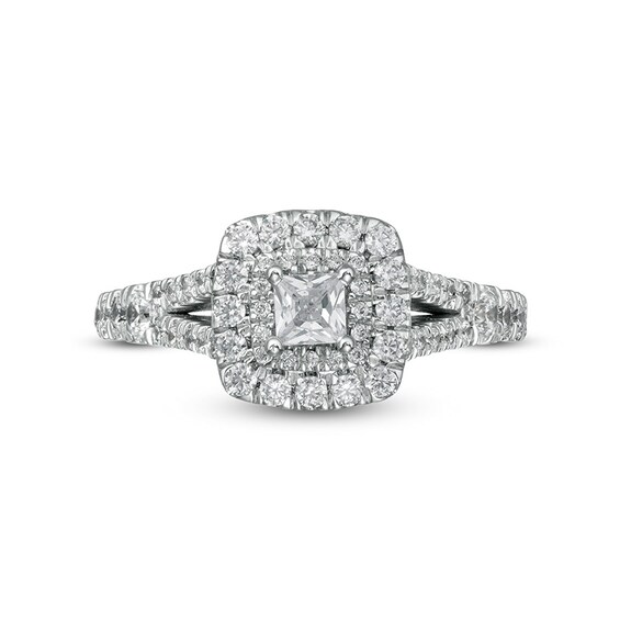 Previously Owned - 3/4 CT. T.w. Diamond Cushion-Shaped Frame Twist Shank Bridal Set in 14K White Gold (I/I2)