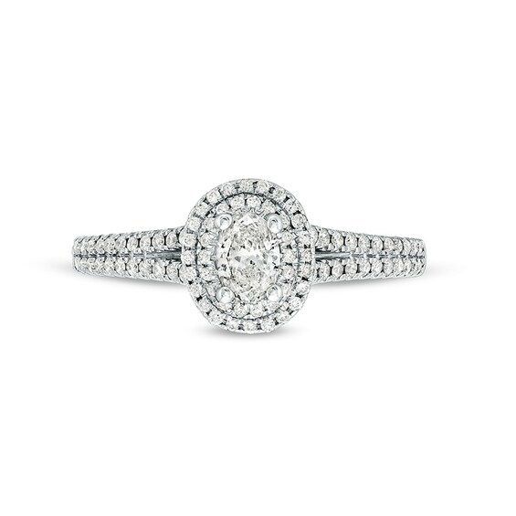 Previously Owned - Celebration Infiniteâ¢ 3/4 CT. T.w. Oval Diamond Frame Split Shank Engagement Ring in 14K White Gold
