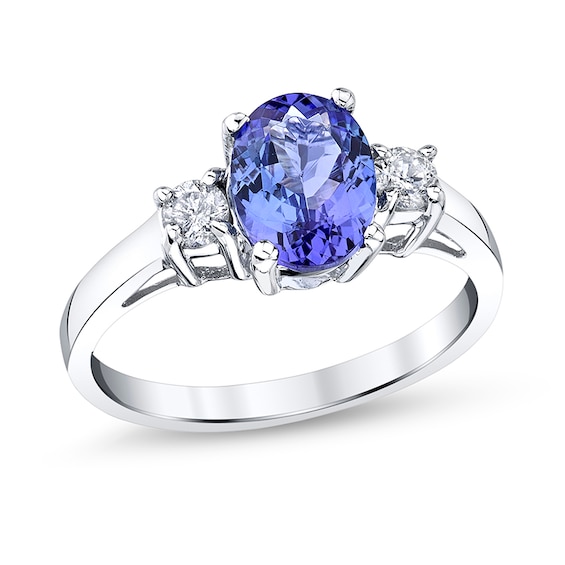 Previously Owned - Oval Tanzanite and 1/5 CT. T.w. Diamond Three Stone Ring in 14K White Gold