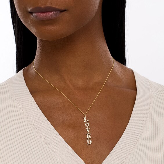 Previously Owned - Serena Williams Jewelry 1/3 CT. T.w. Diamond Vertical Drop "Loved" Pendant in 10K Gold