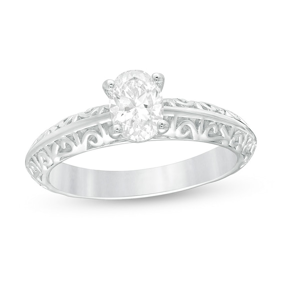 Previously Owned - 3/4 CT. Oval Diamond Solitaire Filigree Engagement Ring in 14K White Gold (I/Si2)