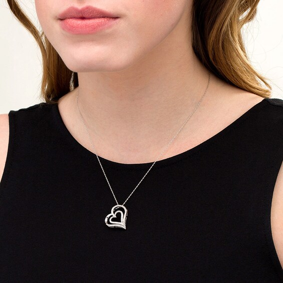 Previously Owned - 1/2 CT. T.w. Diamond Double Tilted Heart Pendant in 10K White Gold