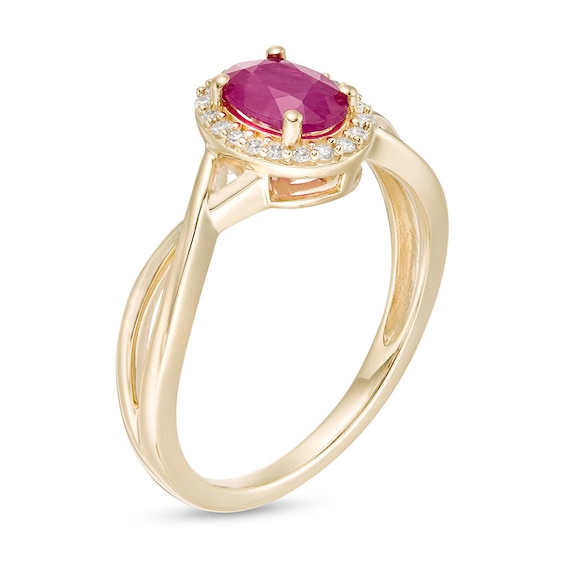 Previously Owned - Oval Ruby and 1/15 CT. T.w. Diamond Frame Twist Shank Ring in 10K Gold