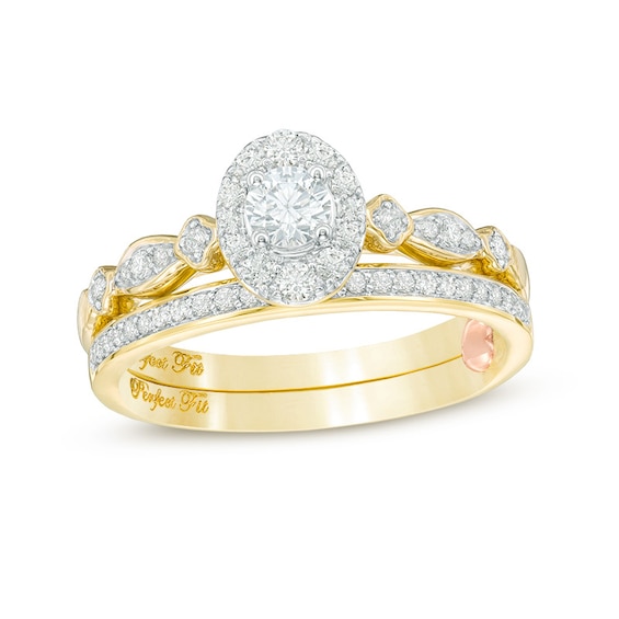 Previously Owned - 1/2 CT. T.w. Diamond Oval Frame Interlocking Bridal Set in 10K Gold