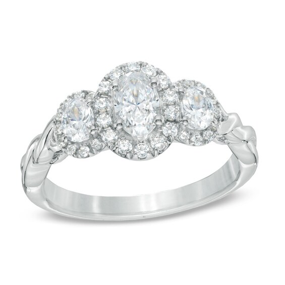 Previously Owned - Celebration Ideal 1 CT. T.w. Oval Diamond Three Stone Engagement Ring in 14K White Gold (I/I1)