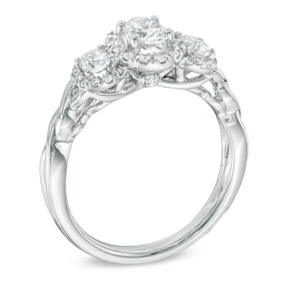 Previously Owned - Celebration Ideal 1 CT. T.w. Oval Diamond Three Stone Engagement Ring in 14K White Gold (I/I1)