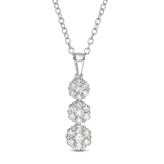 Previously Owned - 1/2 CT. T.w. Multi-Diamond Graduated Three Stone Flower Pendant in 10K White Gold