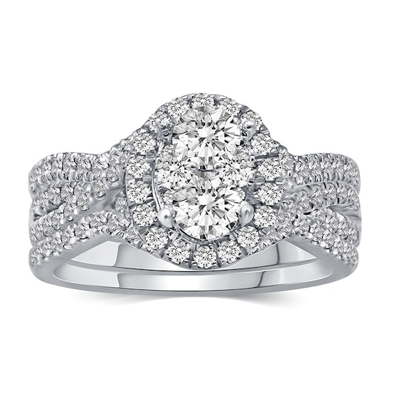 Previously Owned - 1-1/5 CT. T.w. Composite Oval Diamond Frame Three Piece Bridal Set in 14K White Gold