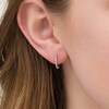 Thumbnail Image 2 of Previously Owned - 1/10 CT. T.W. Diamond Huggie Hoop Earrings in 10K White Gold