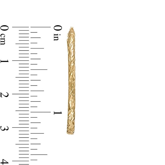 Previously Owned - 30.0mm Diamond-Cut Inside-Out Tube Oval Hoop Earrings in Hollow 10K Gold
