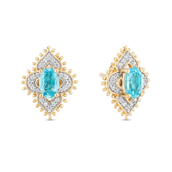 Previously Owned - Enchanted Disney Jasmine Oval Swiss Blue Topaz and 1/6 CT. T.w. Diamond Stud Earrings in 10K Gold