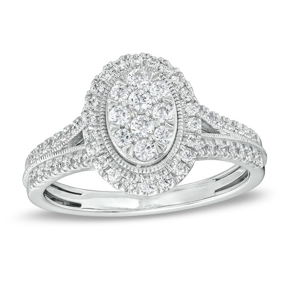 Previously Owned - 1/2 CT. T.w. Oval Multi-Diamond Frame Split Shank Engagement Ring in 10K White Gold