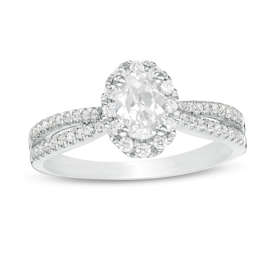 Previously Owned - 3/4 CT. T.w. Oval Diamond Frame Engagement Ring in 14K White Gold (I/I2)