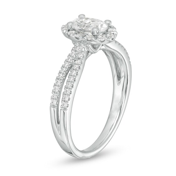 Previously Owned - 3/4 CT. T.w. Oval Diamond Frame Engagement Ring in 14K White Gold (I/I2)