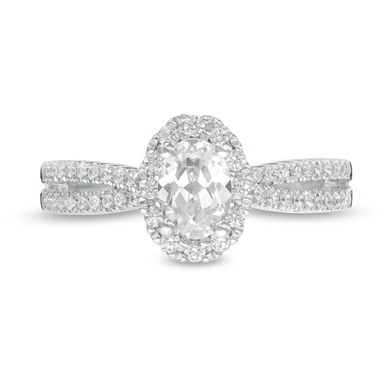 Previously Owned - 3/4 CT. T.w. Oval Diamond Frame Engagement Ring in 14K White Gold (I/I2)