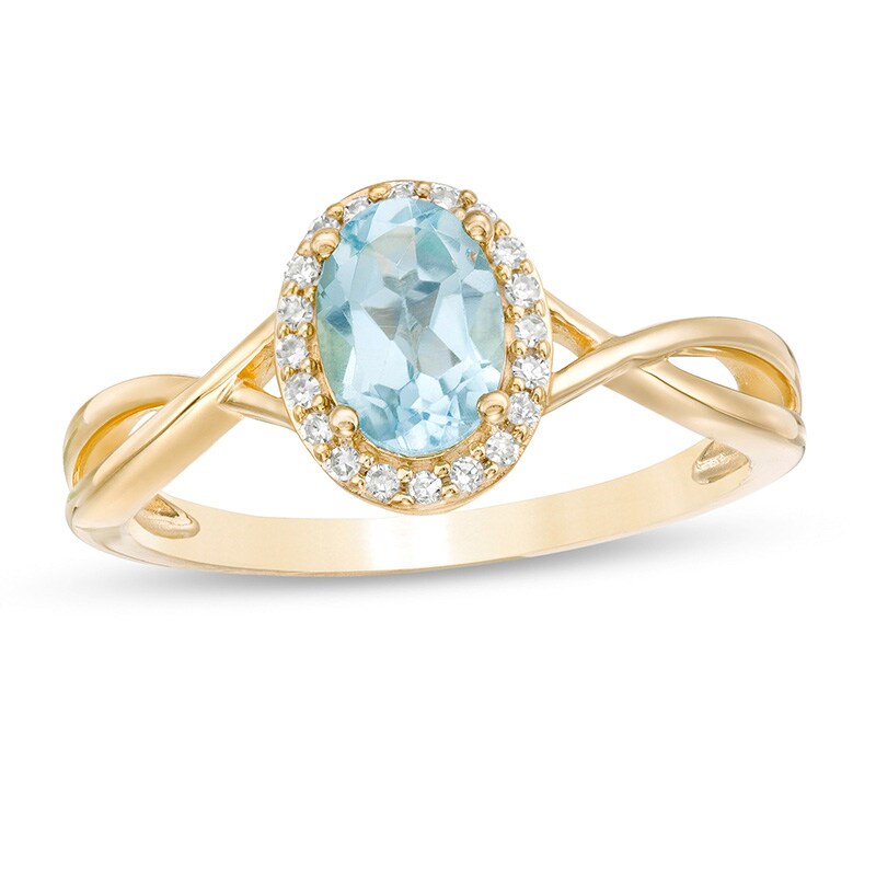 Main Image 1 of Previously Owned - Oval Swiss Blue Topaz and 1/15 CT. T.W. Diamond Frame Twist Shank Ring in 10K Gold