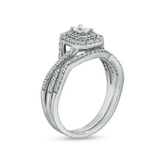 Previously Owned - 5/8 CT. T.w. Emerald-Cut Diamond Frame Bridal Set in 10K White Gold (I/I1)