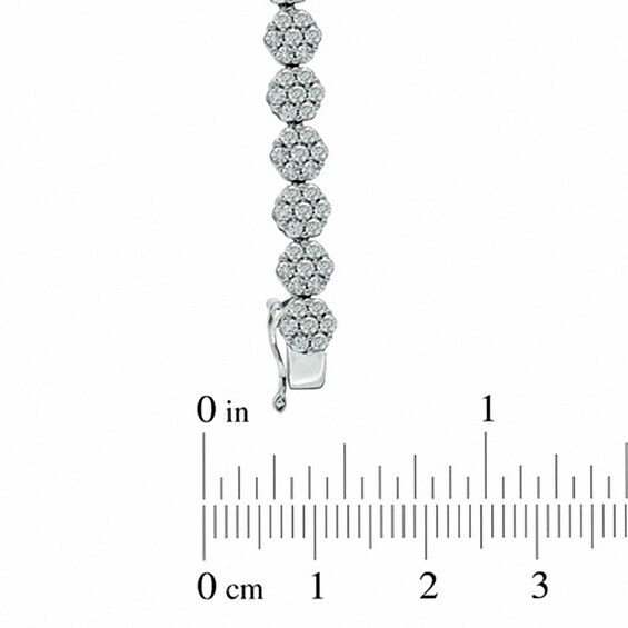 Previously Owned - 5 CT. T.w. Diamond Graduated Flower Bracelet in 14K White Gold