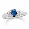 Thumbnail Image 1 of Previously Owned - Oval Blue Sapphire and 1/20 CT. T.W. Diamond Twist Ring in 10K White Gold