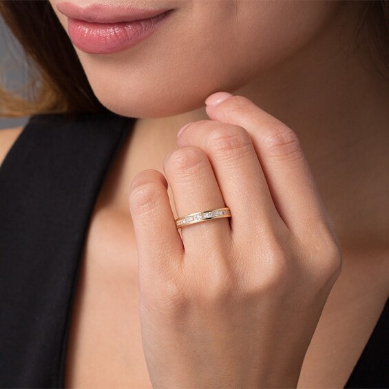 Previously Owned - 1 CT. T.w. Baguette and Round Diamond Eternity Band in 14K Gold (H/Si2)