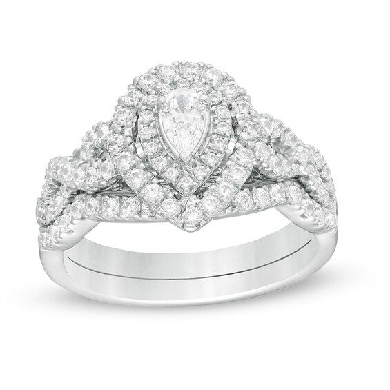 Previously Owned - 1 CT. T.w. Pear-Shaped Diamond Double Frame Twist Shank Bridal Set in 14K White Gold